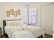 Cozy bedroom with a queen-size bed and neutral decor at 2035 Royal Bay Blvd # 45, Kissimmee, FL 34746