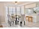 Bright dining area with glass table and chairs, near the kitchen at 2035 Royal Bay Blvd # 45, Kissimmee, FL 34746