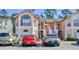 Two-story condo building with parking and landscaping at 2035 Royal Bay Blvd # 45, Kissimmee, FL 34746