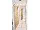 Hallway with light tile floors and two double door closets at 2035 Royal Bay Blvd # 45, Kissimmee, FL 34746