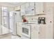 Clean white kitchen with updated appliances and great counter space at 2035 Royal Bay Blvd # 45, Kissimmee, FL 34746