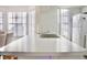 White kitchen island with double sink and breakfast bar at 2035 Royal Bay Blvd # 45, Kissimmee, FL 34746