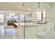 Kitchen with open layout to living room, white cabinets, and island at 2035 Royal Bay Blvd # 45, Kissimmee, FL 34746