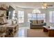 Living area showcasing a cozy seating arrangement and a large TV at 2035 Royal Bay Blvd # 45, Kissimmee, FL 34746