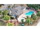 Community pool, hot tub, clubhouse, and lounge chairs at 2035 Royal Bay Blvd # 45, Kissimmee, FL 34746