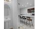 Modern kitchen with island and bar stools at 2106 Crystal Bell St, Orlando, FL 32824