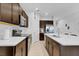 Modern kitchen features dark cabinets, white countertops, and a large island at 2106 Crystal Bell St, Orlando, FL 32824