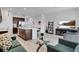 Spacious living room with gray sofas, a glass coffee table, and a large TV at 2106 Crystal Bell St, Orlando, FL 32824