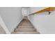 Carpeted staircase with wooden handrail at 2106 Crystal Bell St, Orlando, FL 32824