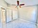 Bedroom with tile floors and double door closet at 248 Lindale St, Lakeland, FL 33809