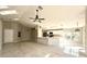 Open concept living area with tile floors and kitchen island at 248 Lindale St, Lakeland, FL 33809