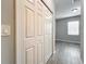 White closet doors in a bedroom with gray walls and wood-look floors at 2559 Sedge Grass Way, Orlando, FL 32824