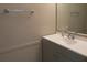 Bathroom featuring a modern sink, vanity, and fixtures at 261 Autumn Ln # 4, Kissimmee, FL 34743