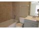 Cozy bathroom featuring tiled shower-tub combo and vanity with storage at 261 Autumn Ln # 4, Kissimmee, FL 34743