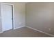Neutral bedroom featuring tiled flooring and a bright white door at 261 Autumn Ln # 4, Kissimmee, FL 34743