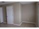Bright and airy bedroom with tile floors and a large window at 261 Autumn Ln # 4, Kissimmee, FL 34743