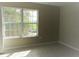 Bedroom with a large window at 261 Autumn Ln # 4, Kissimmee, FL 34743