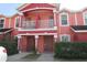 Charming townhome featuring a private balcony and well-maintained front yard at 261 Autumn Ln # 4, Kissimmee, FL 34743