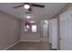 Open concept living room with tile floors and ceiling fan at 261 Autumn Ln # 4, Kissimmee, FL 34743