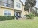Spacious backyard with a screened patio, perfect for outdoor entertaining and enjoying the beautiful landscape at 2833 Oakwater Dr # 169, Kissimmee, FL 34747