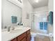 Clean bathroom featuring a modern vanity, a large mirror, and a glass-enclosed shower at 2833 Oakwater Dr # 169, Kissimmee, FL 34747