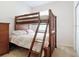 Functional bedroom featuring a bunk bed, wooden ladder, and ample space for children at 2833 Oakwater Dr # 169, Kissimmee, FL 34747