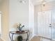 View of entryway with neutral paint, tile floors, and glass topped table at 2833 Oakwater Dr # 169, Kissimmee, FL 34747