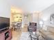 Living room and dining area featuring tile floors and neutral paint scheme at 2833 Oakwater Dr # 169, Kissimmee, FL 34747
