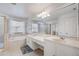 Bathroom with double sinks, soaking tub, and shower at 3209 Eagle Watch Dr, Kissimmee, FL 34746