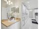Bright bathroom featuring stylish vanity and large mirrors at 3209 Eagle Watch Dr, Kissimmee, FL 34746