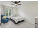Charming bedroom with a ceiling fan and a comfortable bed, perfect for relaxation at 3209 Eagle Watch Dr, Kissimmee, FL 34746