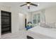 Inviting bedroom with natural light, a cozy chair, and a stylish bedside table at 3209 Eagle Watch Dr, Kissimmee, FL 34746