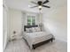 Cozy bedroom featuring a comfortable bed, ample natural light, and a minimalist design at 3209 Eagle Watch Dr, Kissimmee, FL 34746