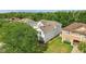 Two-story home with manicured lawn and mature trees shading the facade at 3209 Eagle Watch Dr, Kissimmee, FL 34746