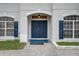 Elegant double front doors with blue paint and arched entryway at 3209 Eagle Watch Dr, Kissimmee, FL 34746