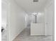 Hallway with hardwood flooring and updated lighting at 3209 Eagle Watch Dr, Kissimmee, FL 34746