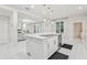 Bright kitchen island view showing stainless steel appliances and view of living room at 3209 Eagle Watch Dr, Kissimmee, FL 34746