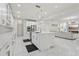 Open-concept kitchen featuring an island with breakfast bar, stainless steel appliances, and white cabinets at 3209 Eagle Watch Dr, Kissimmee, FL 34746
