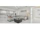 Bright living room featuring an L-shaped sofa, modern lighting, and white tile flooring at 3209 Eagle Watch Dr, Kissimmee, FL 34746