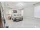 Serene main bedroom featuring a plush bed, chandelier, and large windows with sheer curtains at 3209 Eagle Watch Dr, Kissimmee, FL 34746