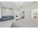 Spacious main bedroom showcasing a plush bed, sitting area, and a view into an adjacent room at 3209 Eagle Watch Dr, Kissimmee, FL 34746