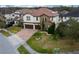 Two-story house with a two-car garage and landscaped yard at 3240 Preserve Dr, Orlando, FL 32824
