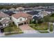 Two-story house with a two-car garage and landscaped yard at 3240 Preserve Dr, Orlando, FL 32824