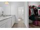 Bathroom features granite vanity and walk-in closet at 3240 Preserve Dr, Orlando, FL 32824
