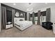 Spacious bedroom with large TV and comfortable seating at 3240 Preserve Dr, Orlando, FL 32824