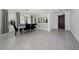 Elegant dining room featuring a glass table and modern chandelier at 3240 Preserve Dr, Orlando, FL 32824