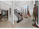 Grand entryway with a stunning staircase and wine cellar at 3240 Preserve Dr, Orlando, FL 32824