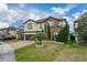 Two-story house with stone accents and a palm tree at 3240 Preserve Dr, Orlando, FL 32824