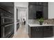 Kitchen with double ovens, wine storage, and stylish backsplash at 3240 Preserve Dr, Orlando, FL 32824