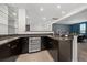 Modern wet bar with granite countertop and wine cooler at 3240 Preserve Dr, Orlando, FL 32824